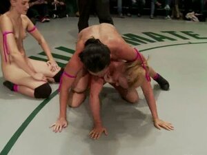 A few nude girls fight on a ring and play with